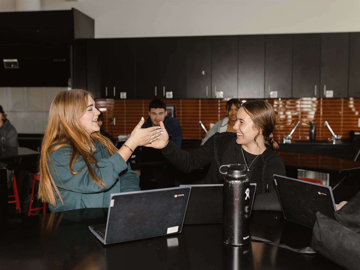 Students Giving High Fives